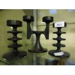 A pair of Robert Welch cast metal candle holders together with one Robert Welch candelabra