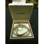 A Nomination expanding bracelet together with a gold plated expanding bracelet in a Pandora box