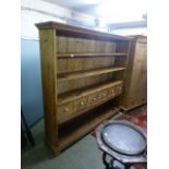 A country style pine dresser having six drawers above open storage CONDITION REPORT: