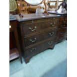 A Georgian style mahogany chest of three long drawers