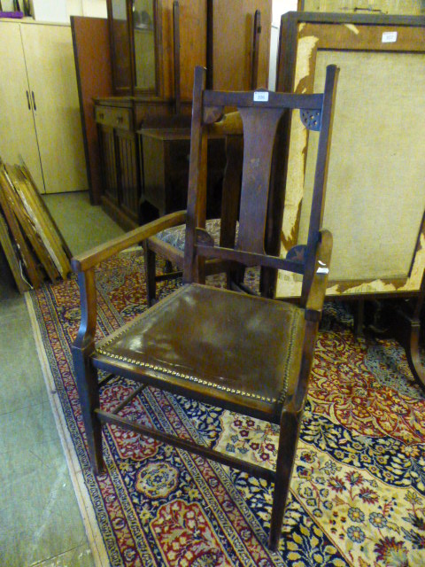 An early 20th century open arm chair