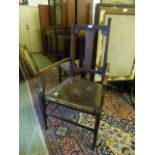 An early 20th century open arm chair