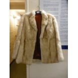 A ladies cream fur jacket