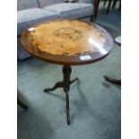 A reproduction circular topped pedestal table