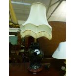 A gold painted ceramic bird table lamp