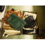 Two trays containing an assortment of ladies handbags