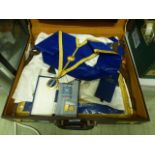 An Attaché case containing Masonic items to include apron, jewels etc.