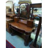 A Victorian mahogany duchess dressing table having a bow front drawer section with swing mirror and