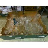 Two trays of glassware to include candlesticks, vases, drinking vessels etc.