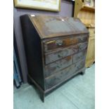 An 18th century oak bureau,