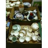 Two trays containing a decorative part tea set, vases, decorative plates etc.