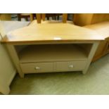 A grey painted corner TV cabinet with two drawers (95.
