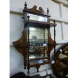 A set of Edwardian rosewood and marquetry wall shelves with beveled mirror back