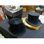 A Christie's Imperial top hat in leather case together with a collapsible top hat in box