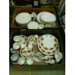 Two trays of ceramic tableware to include rose design and gold rim sets