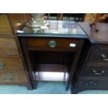 A mahogany side table having single drawer above open storage