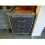 An early 20th century industrial metal four drawer cabinet