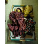 A tray containing a teenage style doll