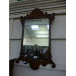 A mid 18th century walnut fretwork mirror A/F