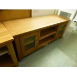 An oak TV audio cabinet with two glazed doors (87.