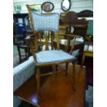 An early 20th century birch open arm bedroom chair