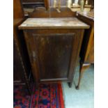 An early 20th century oak bedside cabinet