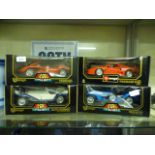 Four boxes Burago die cast metal model cars to include Ferrari, Alfa Romeo etc.