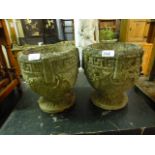 A pair of weathered garden stoneware pots