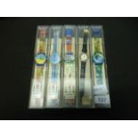 Five boxed Swatch collectors watches