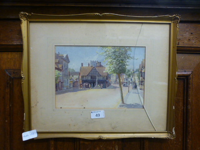 A framed and glazed watercolour of Henley In Arden signed G.A.