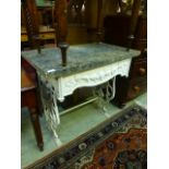 A cast metal based stand with grey marble top