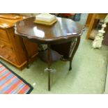 An early 20th century mahogany occasional table with under tier