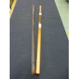 A leather covered baton together with a presentation cadets baton