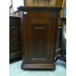 A 19th century oak wall hanging corner cupboard