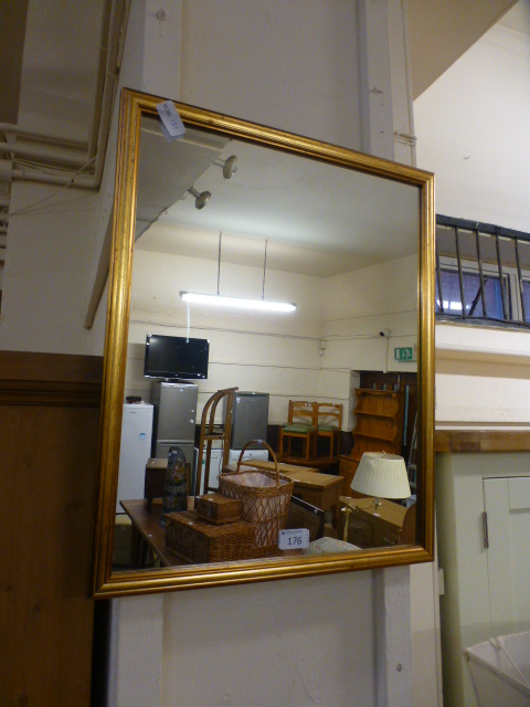 A rectangular gilt framed wall mirror