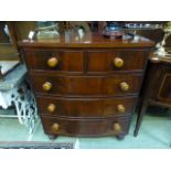 A late Victorian mahogany veneer bow fronted chest of two short over three long drawers