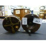 Two wooden fishing reels