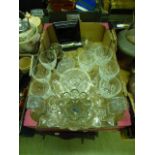 A tray containing mainly glassware, silvered napkin rings etc.