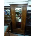 An early 20th century mahogany single door wardrobe,