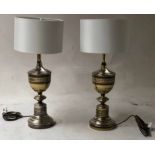 LAMPS, a pair, Moorish style pierced silvered metal vase form, 75cm H with shades.