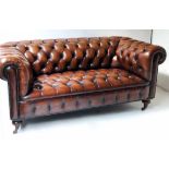 CHESTERFIELD SOFA,Victorian style hand finished leaf brown leather with curved deep buttoned back,