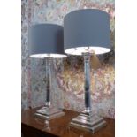 TABLE LAMPS, a pair, silver plated each with Corinthian capped reeded column and stepped plinth,