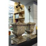 TABLE LAMPS, a pair, in the form of weathered stone finials, bases 35cm H, overall 76cm H.