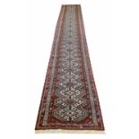 QASHQAI LONG RUNNER, 585cm x 85cm, rows of geometric medallions within matching borders.