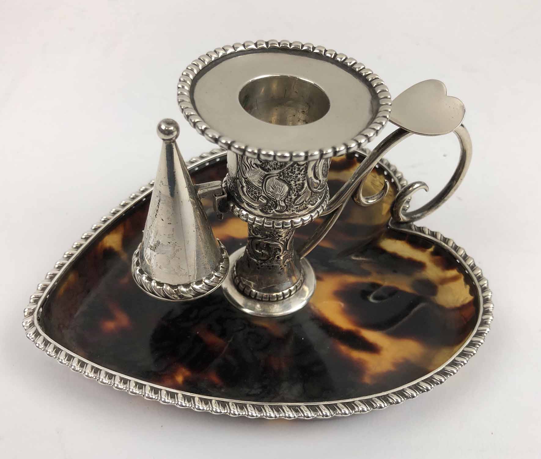 SILVER AND TORTOISESHELL CANDLE HOLDER AND SNUFFER.