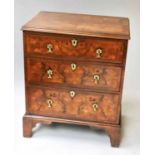 CHEST, English 18th century style figured walnut of small proportions with three long drawers,