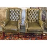 WING ARMCHAIRS, a pair, Georgian style in close nailed green leather, 77cm W.