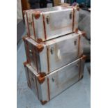 AVIATOR STYLE TRUNKS, a graduated set of three, 81cm at widest.