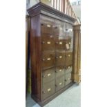 LOCKERS, Victorian mahogany, a set of fifteen hinged panelled doors with plinth and cornice,