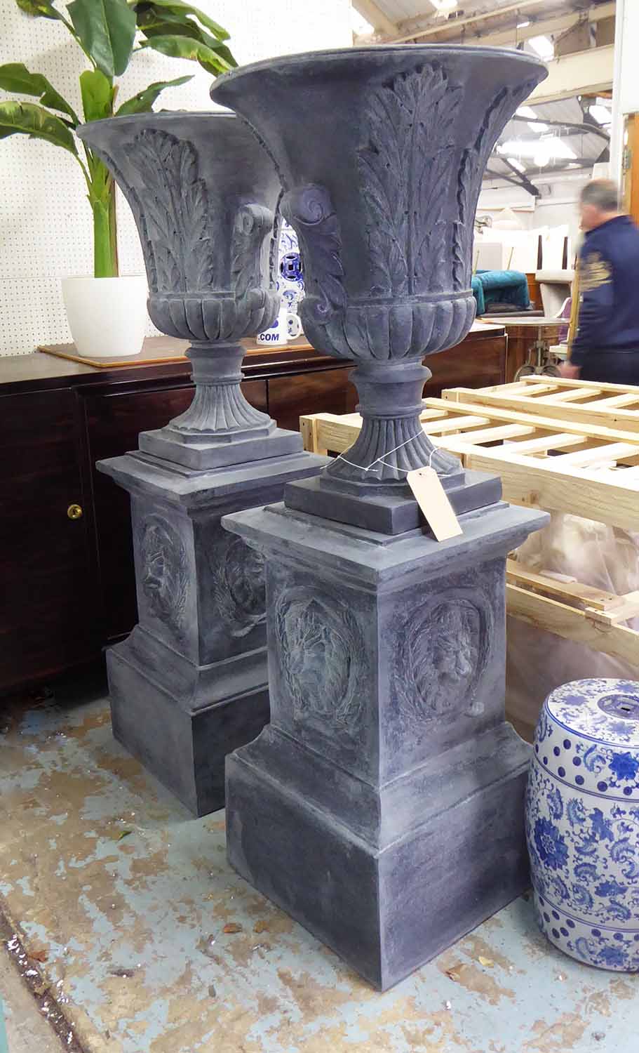 GARDEN URNS, a pair, on stands, in the English country house style, 157cm H.